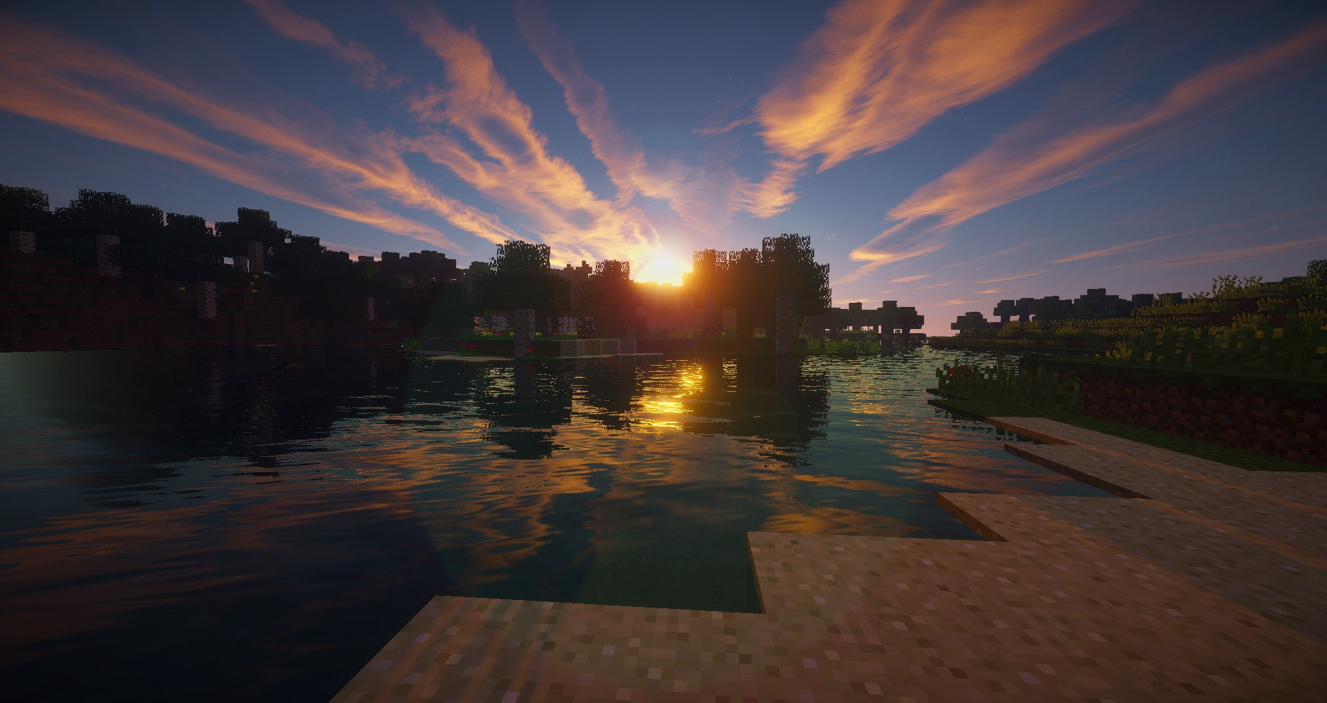 Un mundo de Minecraft al atardecer junto a un lago